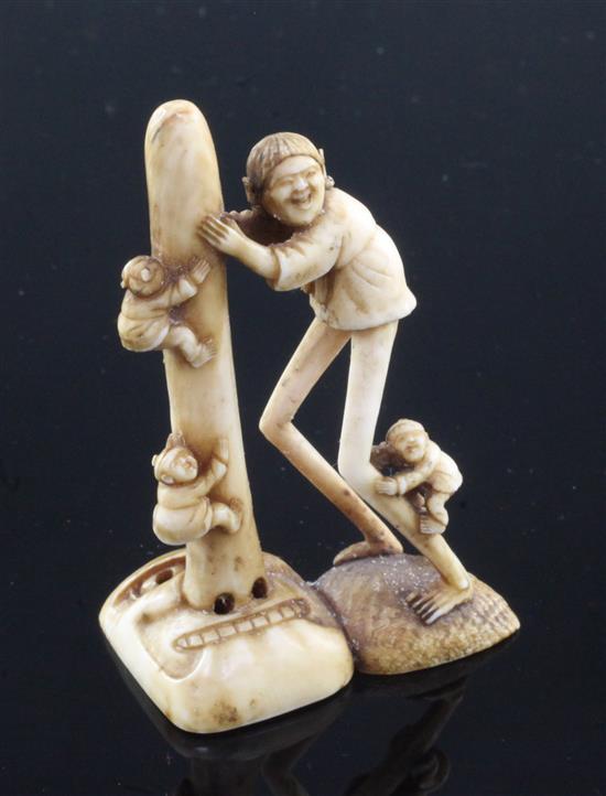 A Japanese ivory netsuke of Ashinaga holding the nose of a Tengu mask, Edo period, 6.9cm
